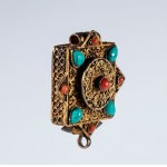 A Gau amulet holder in gilded silver and semiprecious stones. Tibet, 19th century