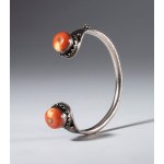 Tibetan silver bracelet with two antique coral beads. Tibet, 19th century.