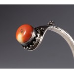 Tibetan silver bracelet with two antique coral beads. Tibet, 19th century.