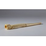 A carved elephant ivory pipe in the shape of a dragon