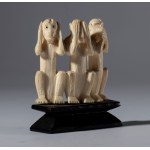 A small elephant ivory sculpture on a wooden base depicting the three monkeys Mizaru, Kikazaru, and Iwazaru. Japan, 19th century.