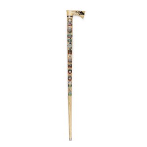 Wooden walking stick with badges of Polish mountain huts