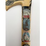 Wooden walking stick with badges of Polish mountain huts