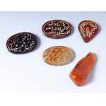 Lot of 14 engraved carnelians and 5 ambers, Lot of 14 engraved carnelians and 5 ambers