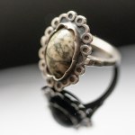 Metalwork. Ring with granite.