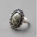 Metalwork. Ring with granite.