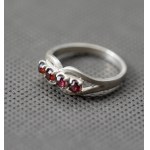 Warmet. "Mustache" ring with pink eyes.