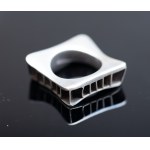 A large modernist style ring.