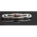 Art Deco brooch with amber glass.