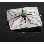 Imago Artis. Beautiful filigree brooch with a green eye.