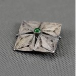 Imago Artis. Beautiful filigree brooch with a green eye.