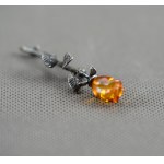 Rose brooch with amber.