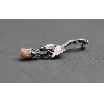 Rose brooch with pink flower.