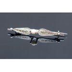 Imago Artis. Filigree brooch with a white eyelet.