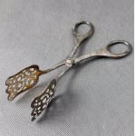 Plated pre-war cake tongs.