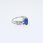 Silver ring with natural Tanzanites and white Sapphires