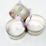 Three silver-plated napkins
