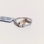 Silver ring with natural serenite and topazes