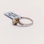 Silver ring with natural serenite and topazes