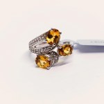 Silver ring with natural scapolite and topazes