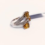 Silver ring with natural scapolite and topazes