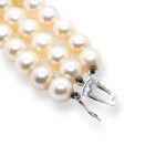 Pearl necklace with emerald diamond clasp