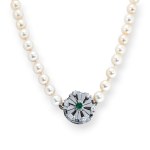 Pearl necklace set with emeralds and diamonds