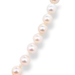 Collier de perles serti d'émeraudes et de brillants